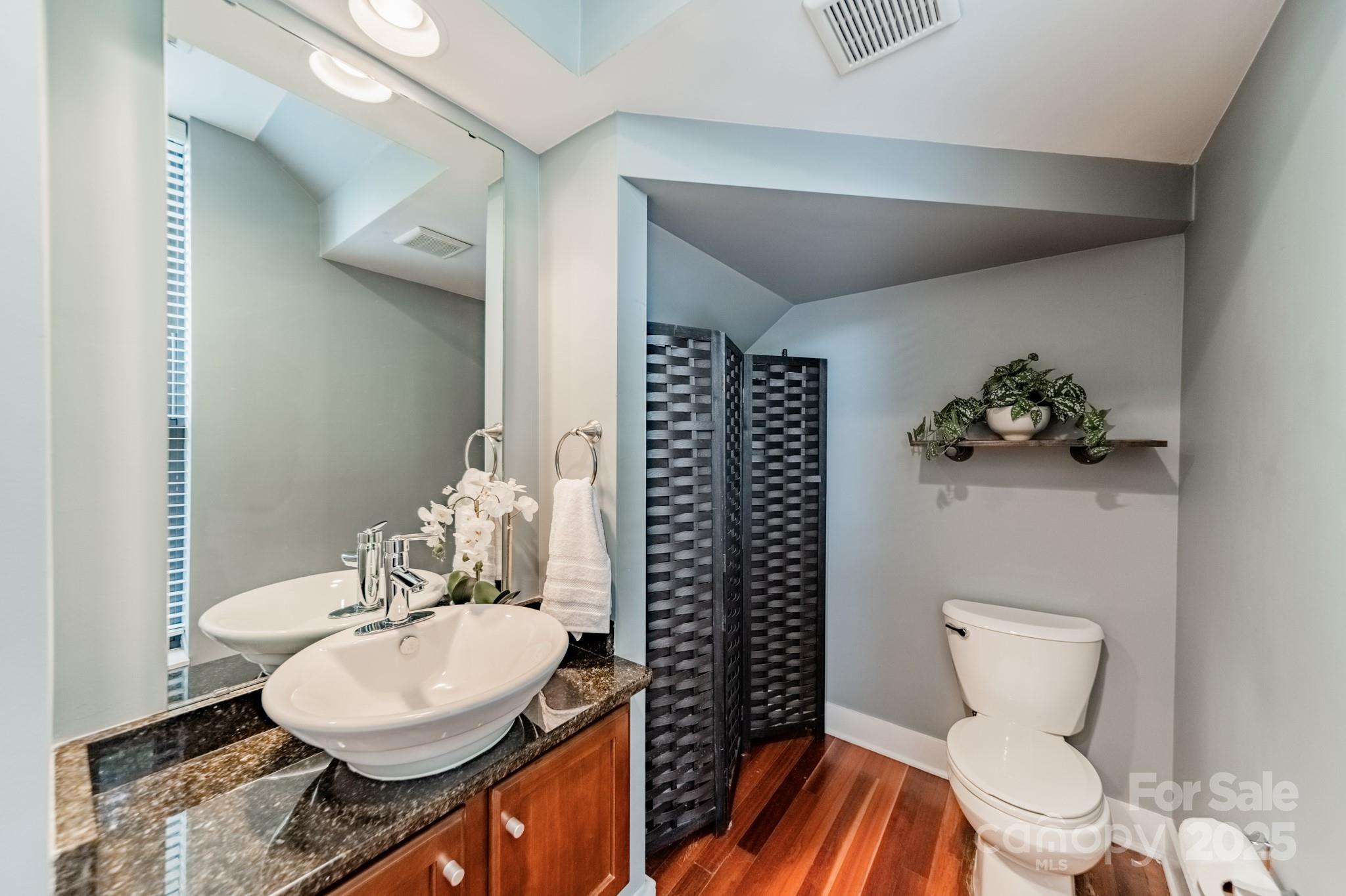 2988 Textile Way Charlotte, NC 28205 - Photo 14 of 36 a bathroom with a sink toilet and a mirror