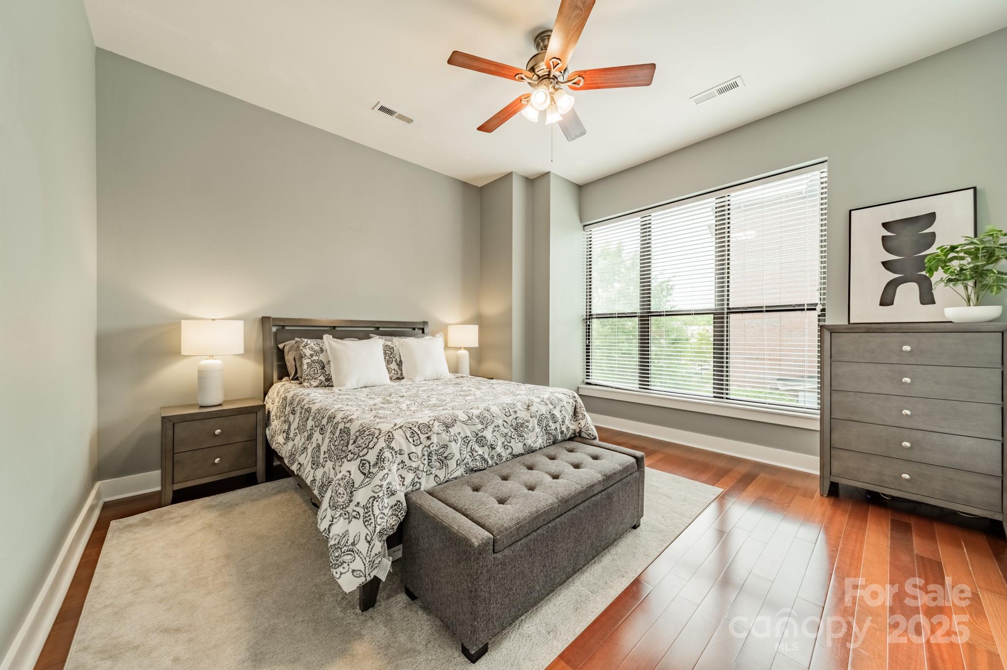 2988 Textile Way Charlotte, NC 28205 - Photo 16 of 36 a bedroom with a large bed and a window