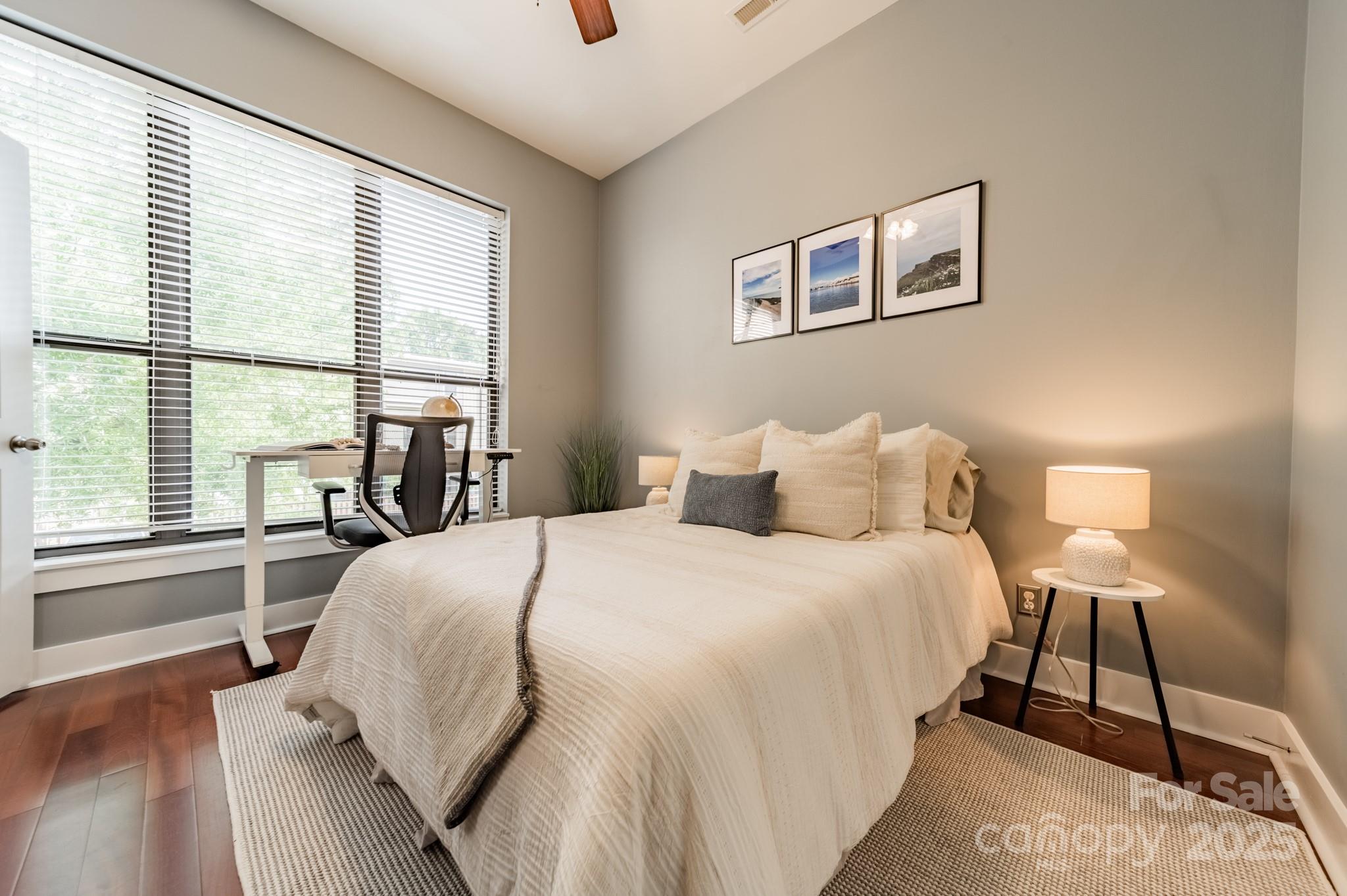 2988 Textile Way Charlotte, NC 28205 - Photo 21 of 36 a bedroom with a large bed and a large window
