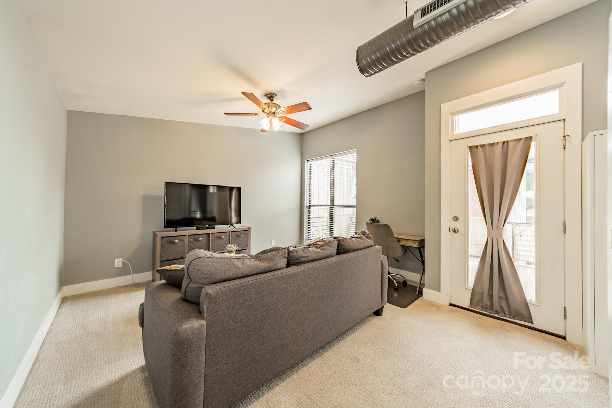 2988 Textile Way Charlotte, NC 28205 - Photo 23 of 36 a living room with furniture and a flat screen tv