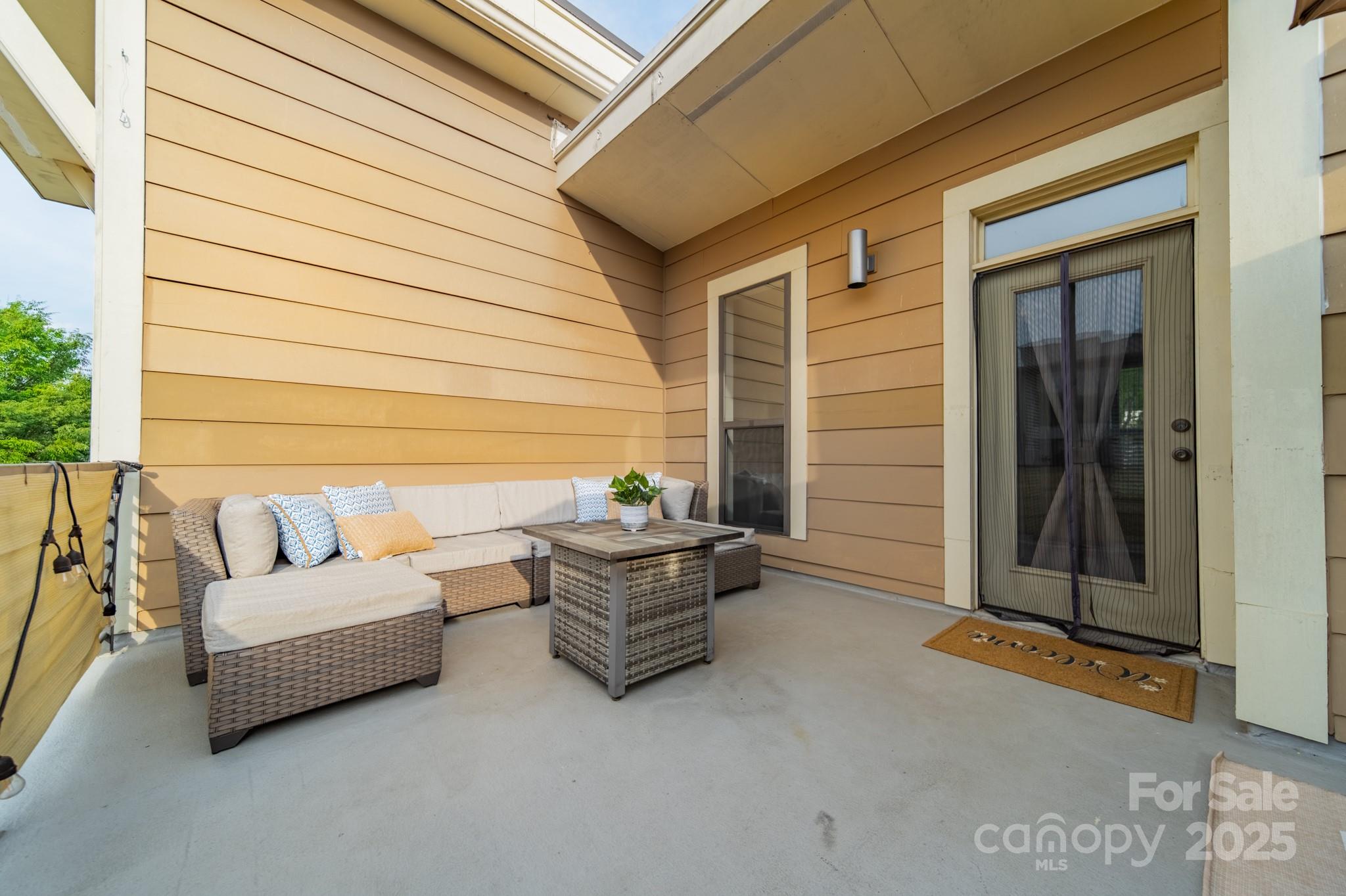 2988 Textile Way Charlotte, NC 28205 - Photo 27 of 36 a backyard of a house with sofas