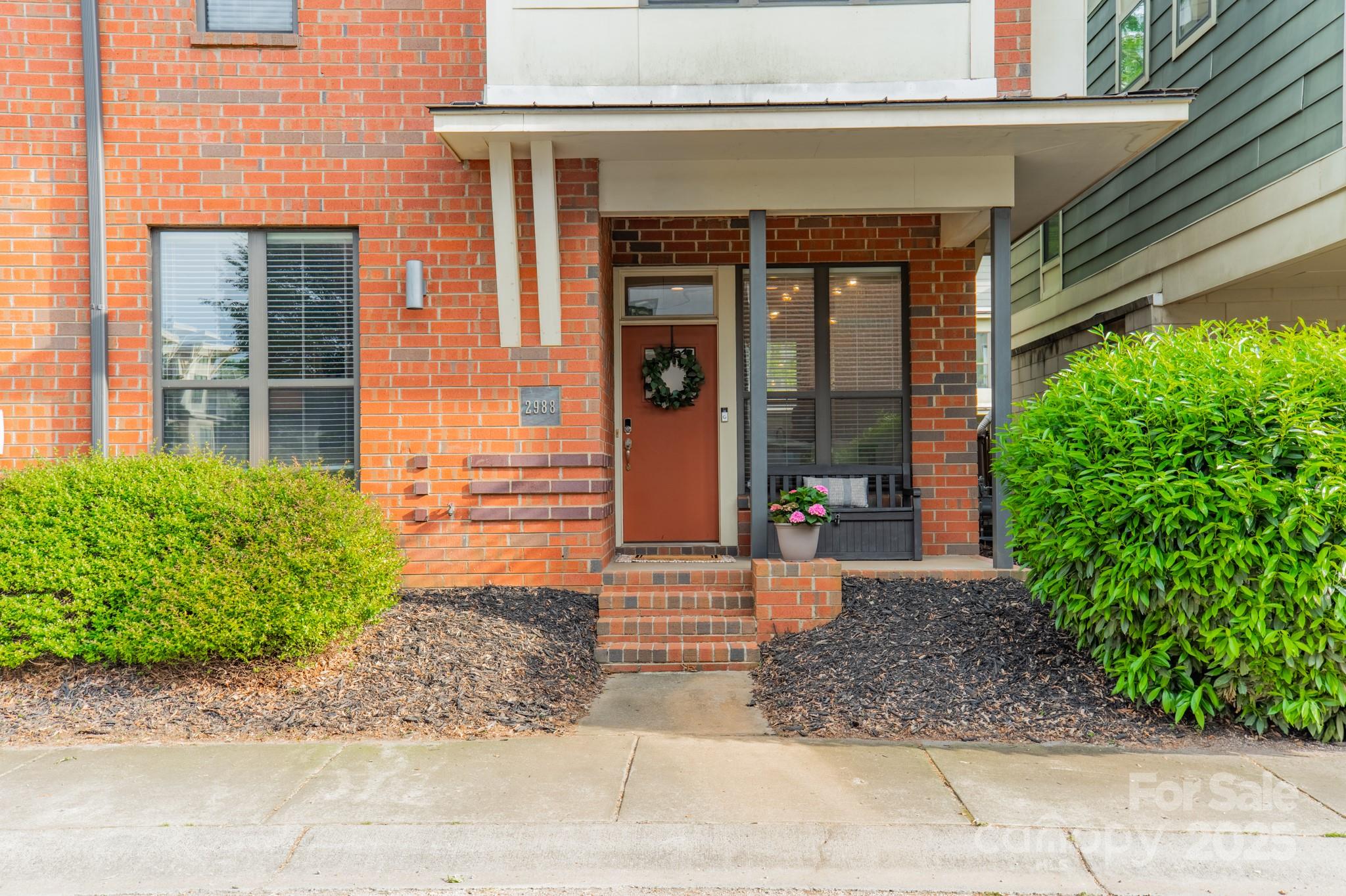 2988 Textile Way Charlotte, NC 28205 - Photo 3 of 36 a front view of a house with garden