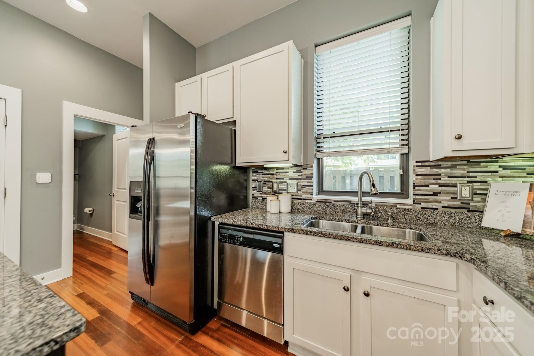 2988 Textile Way Charlotte, NC 28205 - Photo 6 of 36 a kitchen with stainless steel appliances granite countertop a refrigerator and a sink