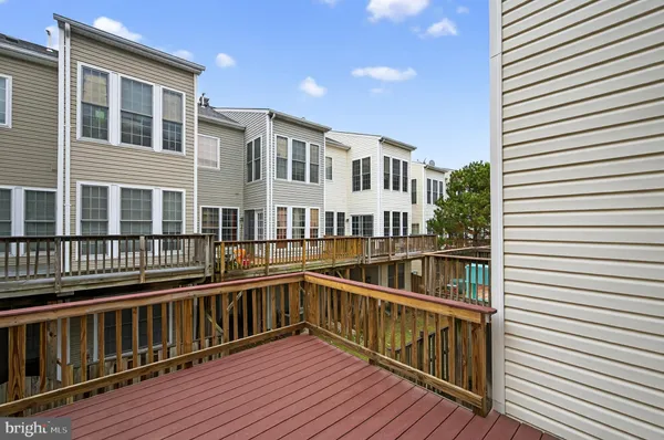 a view of a balcony with wooden floor