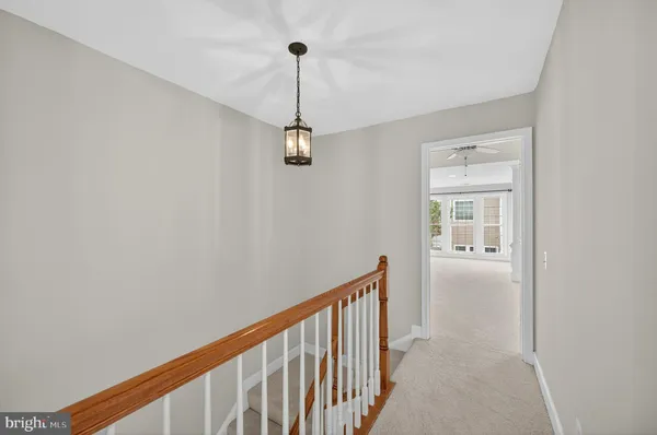 a view of a hallway with a window