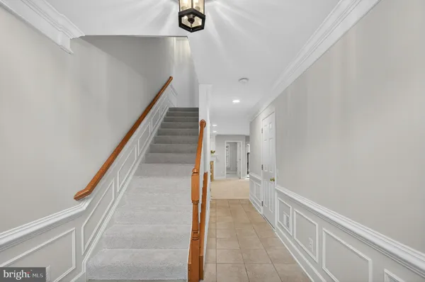a view of a hallway with stairs