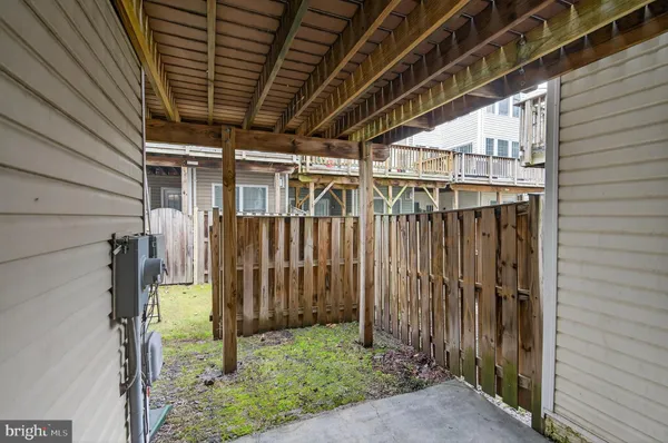 a view of a porch with wooden floor