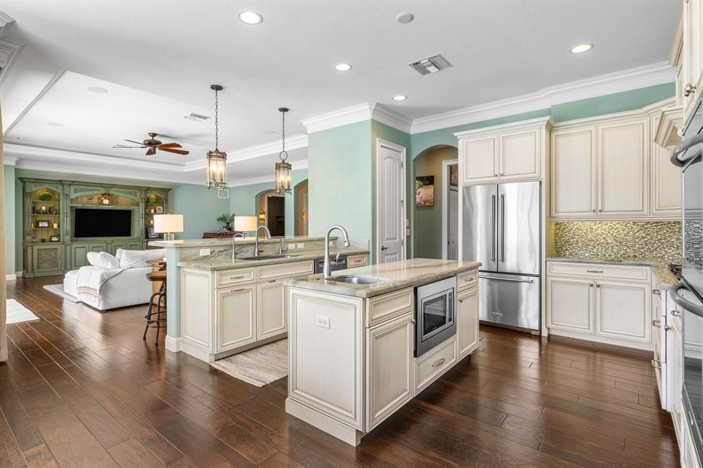 624 Northeast 3rd Avenue Boca Raton, FL 33432 - Photo 13 of 64 a kitchen with stainless steel appliances granite countertop a stove and cabinets