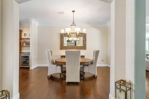 a bathroom with a granite countertop sink and a large mirror