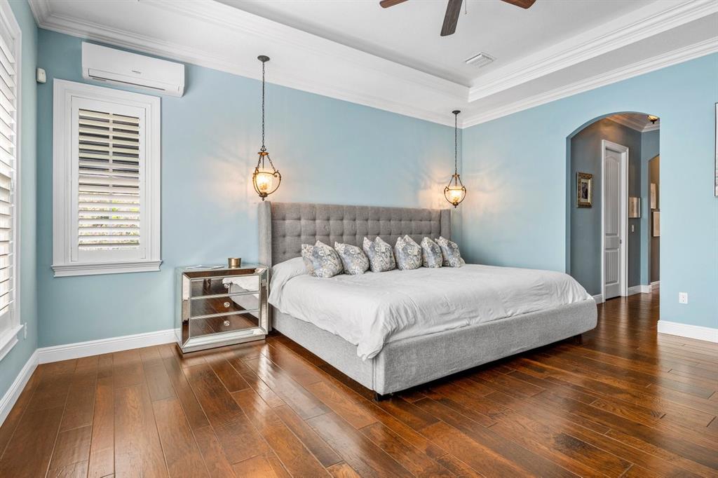 624 Northeast 3rd Avenue Boca Raton, FL 33432 - Photo 22 of 64 a bedroom with a bed a table and wooden floor