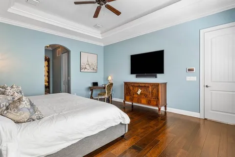 a bedroom with a bed and a bookshelf