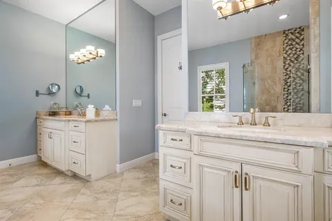 a kitchen with a sink a stove and cabinets