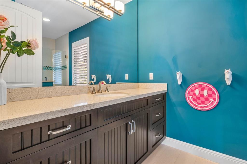 624 Northeast 3rd Avenue Boca Raton, FL 33432 - Photo 29 of 64 a bathroom with a granite countertop sink and a large mirror
