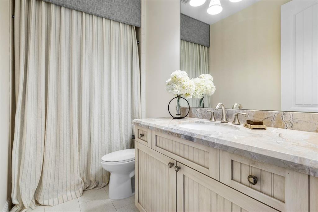 624 Northeast 3rd Avenue Boca Raton, FL 33432 - Photo 32 of 64 a bathroom with a granite countertop sink and a toilet