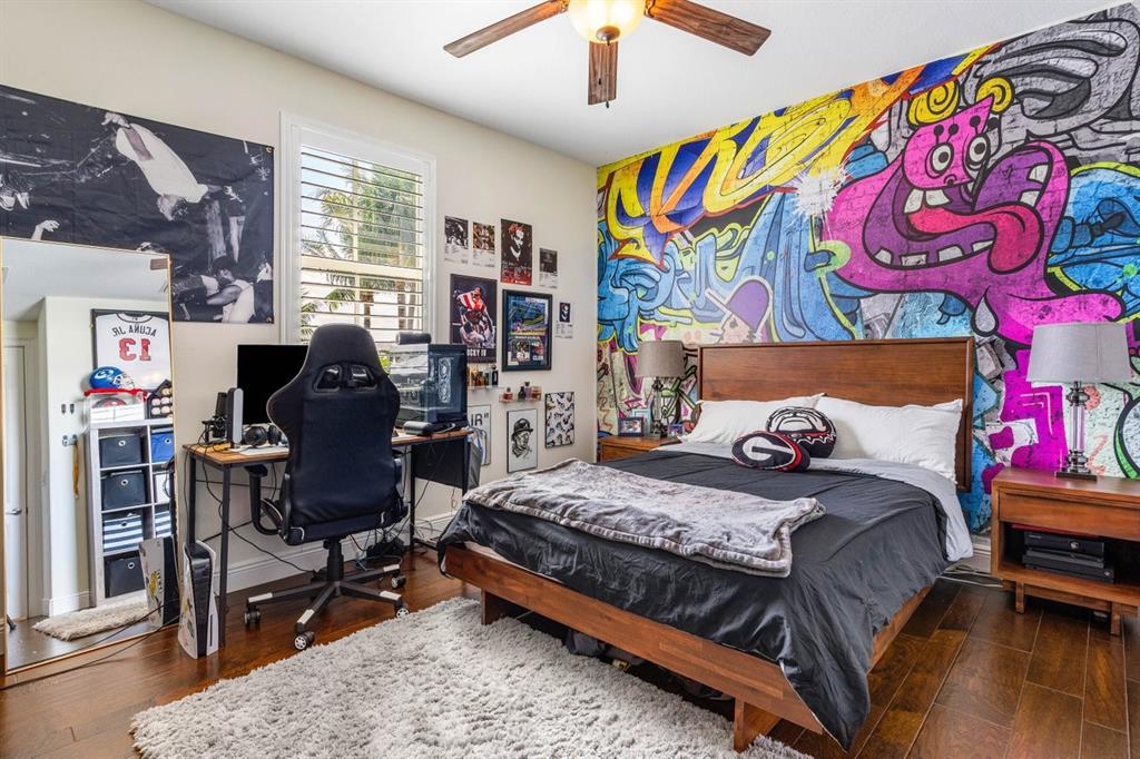 624 Northeast 3rd Avenue Boca Raton, FL 33432 - Photo 33 of 64 a bedroom with a bed and a bookshelf