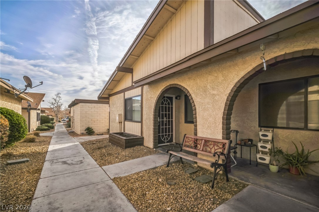 View of side of home featuring stucco siding