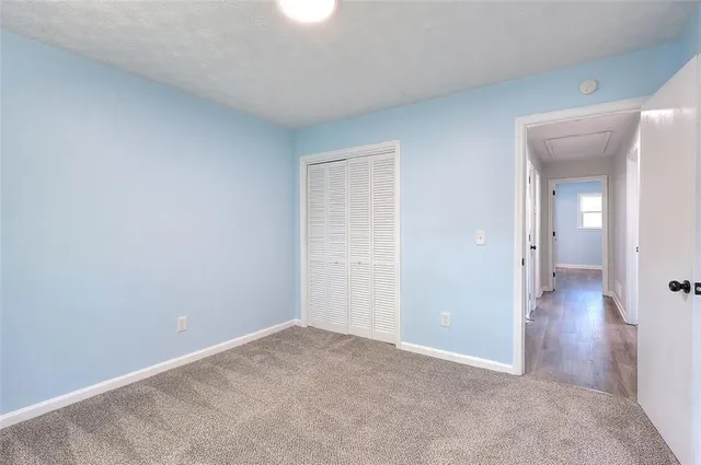 an empty room with a mirror