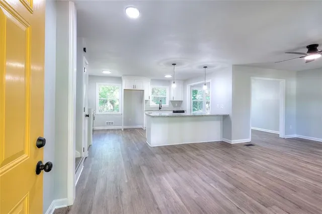a view of kitchen with wooden floor