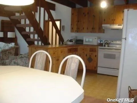 a kitchen with stainless steel appliances granite countertop a sink and a stove