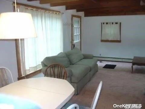 a bedroom with furniture and a window