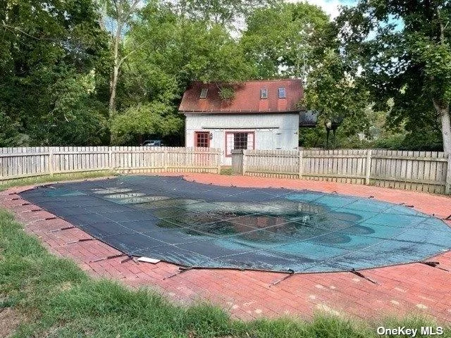 a pathway of a house with a yard