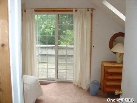 a bedroom with furniture and window