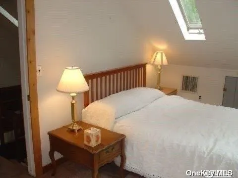 a bedroom with a bed and a table in it