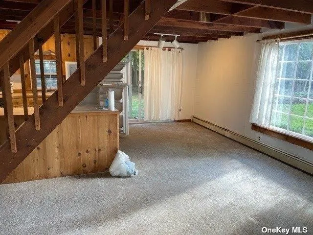 a view of a room with wooden walls