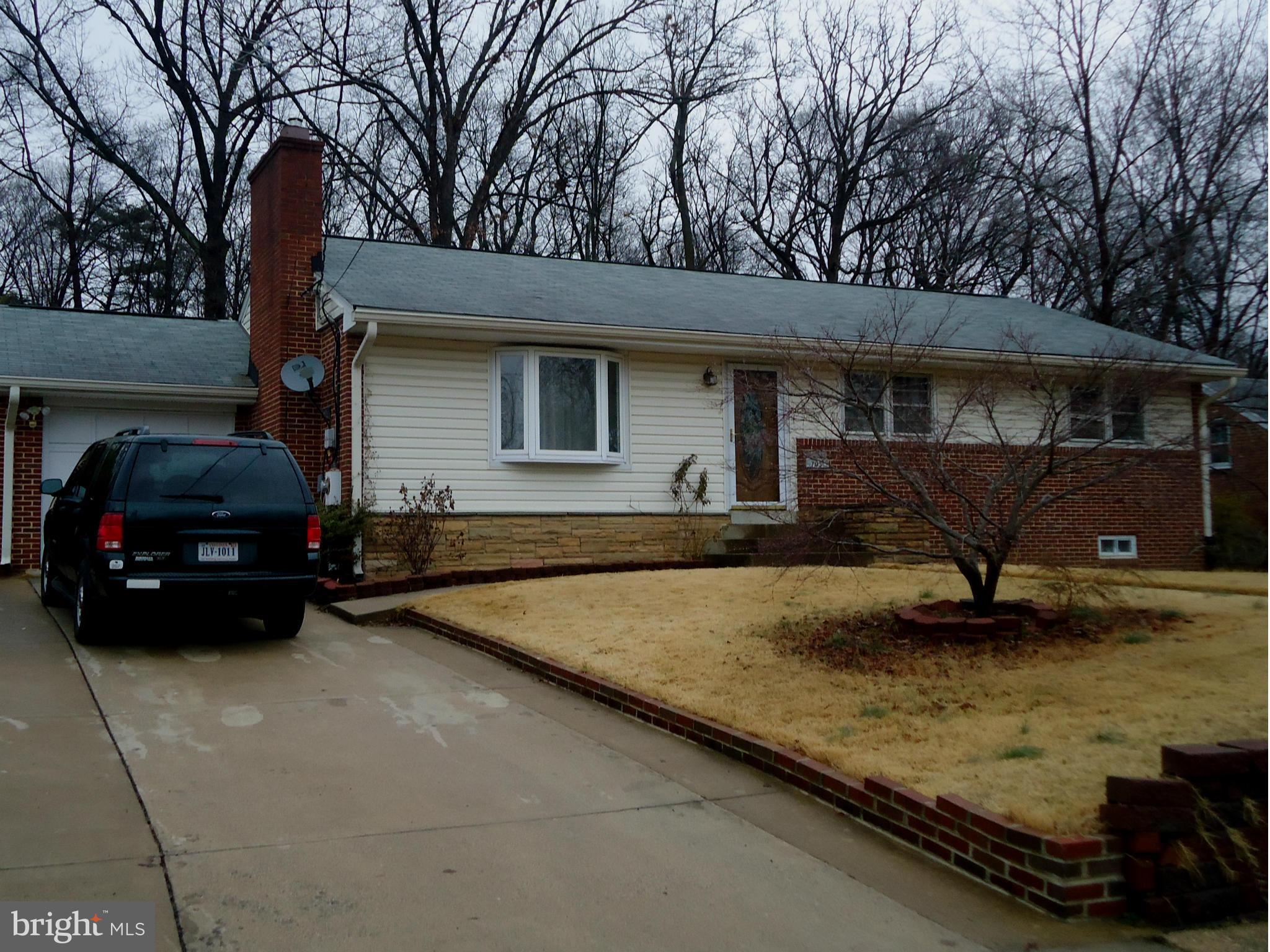 a view of a car parked in front of a house
