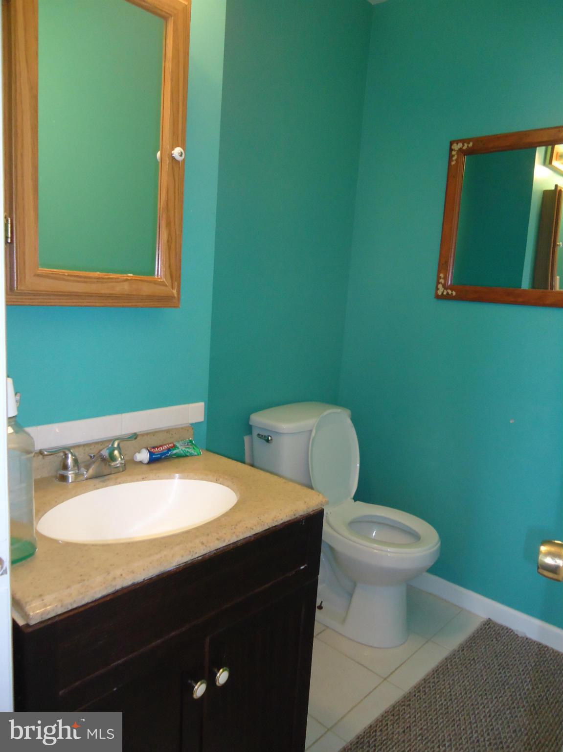 7031 Quander Road Alexandria, VA 22307 - Photo 10 of 12 a bathroom with a sink and a mirror