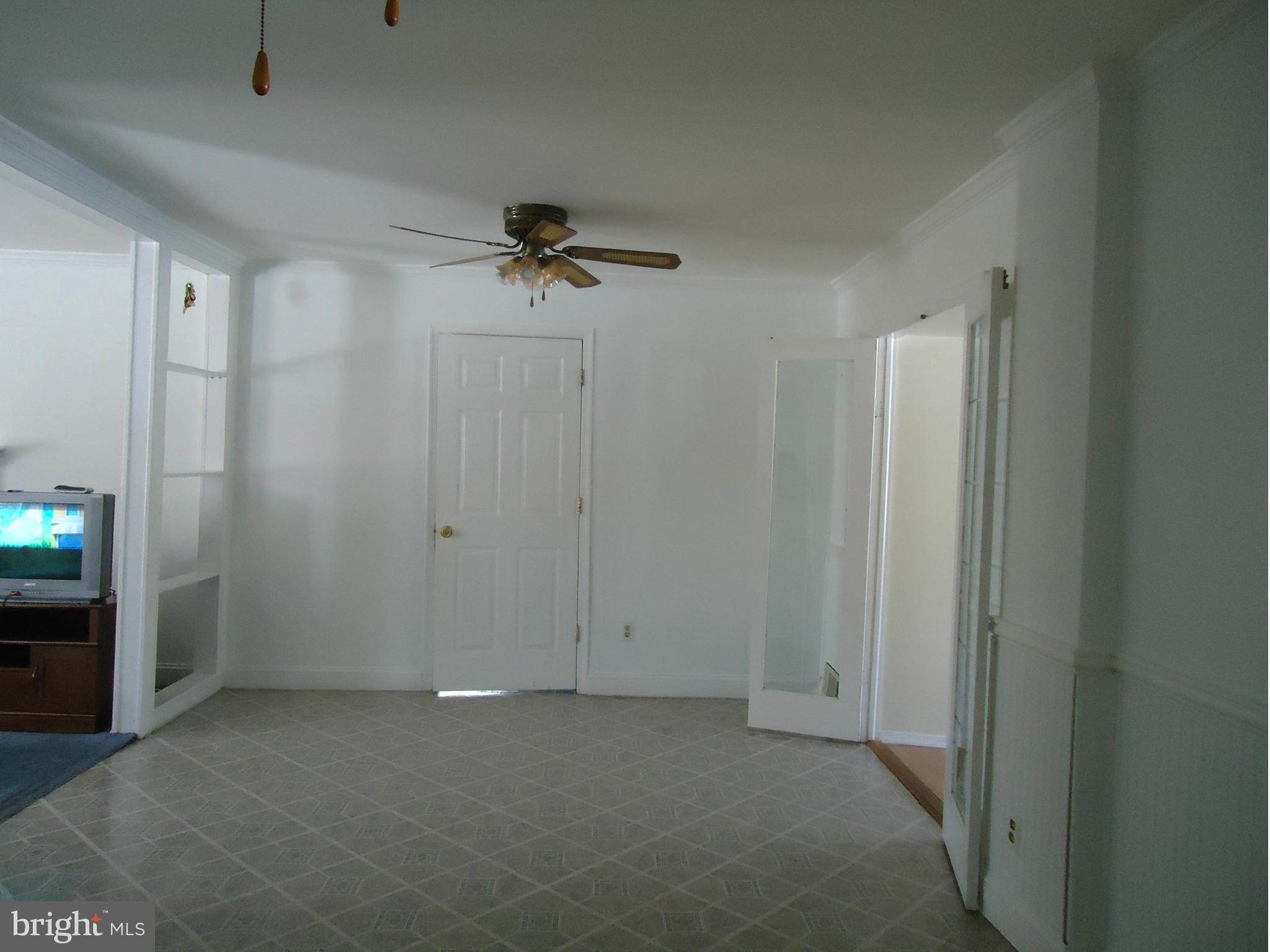 7031 Quander Road Alexandria, VA 22307 - Photo 3 of 12 a view of room with a hallway