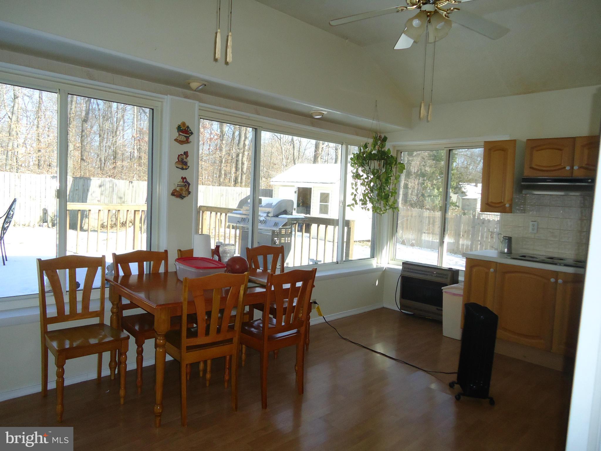 7031 Quander Road Alexandria, VA 22307 - Photo 4 of 12 a view of a dining room with furniture window and outside view