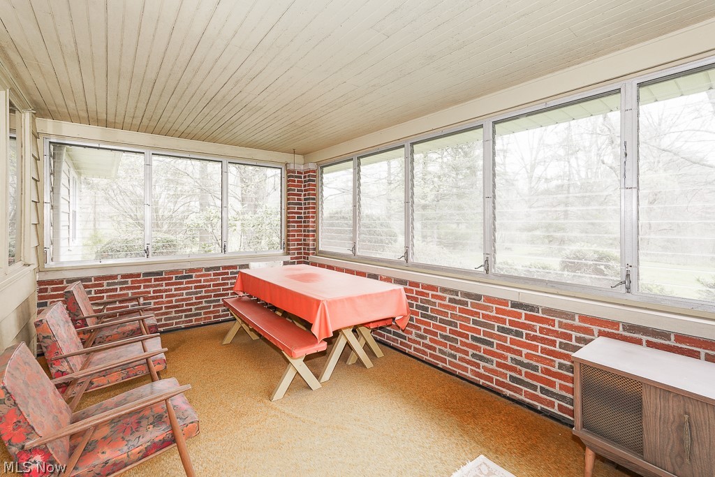 13028 Root Road Columbia Station, OH 44028 - Photo 9 of 35 Sunroom / solarium with a healthy amount of sunlight and wood ceiling