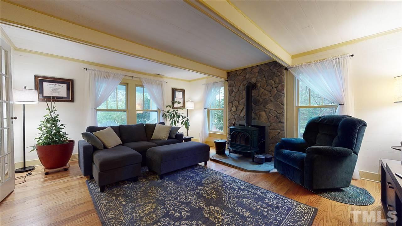 4007 Redwood Road Durham, NC 27704 - Photo 12 of 30 This is a cozy space equipped with a Jotul wood burning stove.