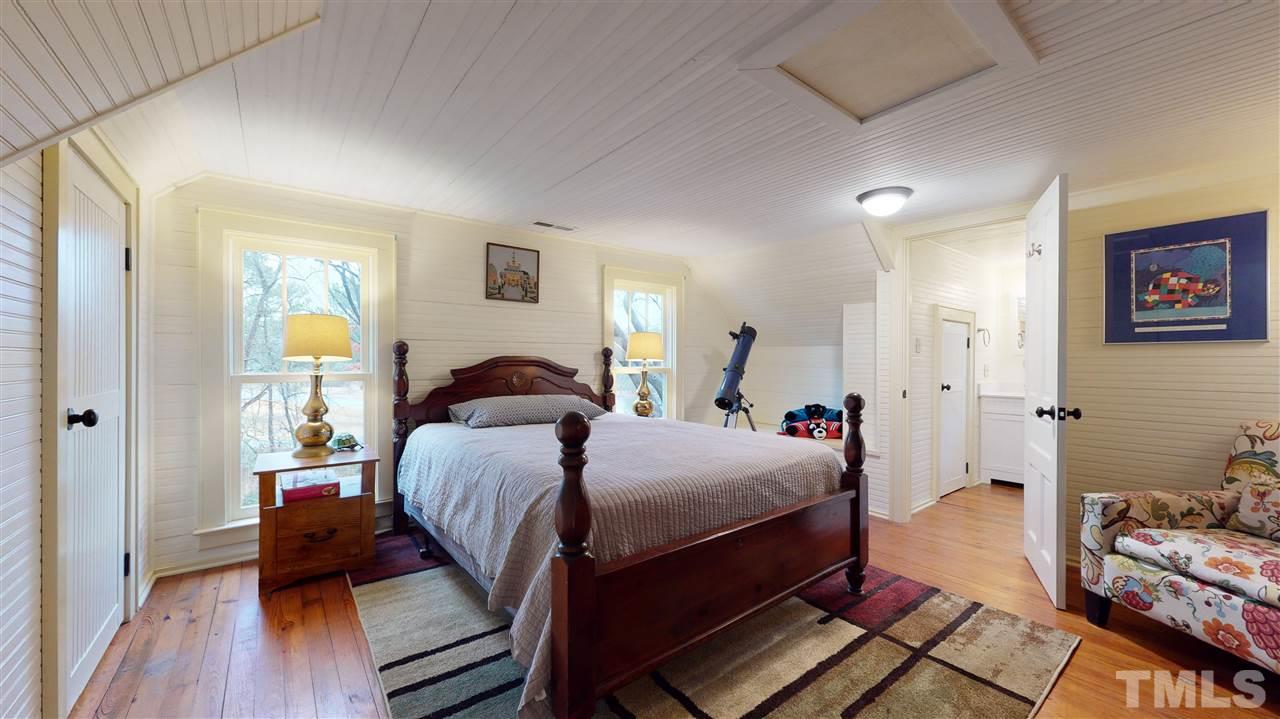 4007 Redwood Road Durham, NC 27704 - Photo 26 of 30 This second floor, secondary bedroom has a full bathroom attached.