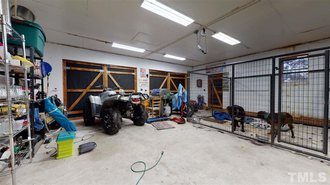 4007 Redwood Road Durham, NC 27704 - Photo 29 of 30 Inside the two car garage that is connected to the workshop and loft.