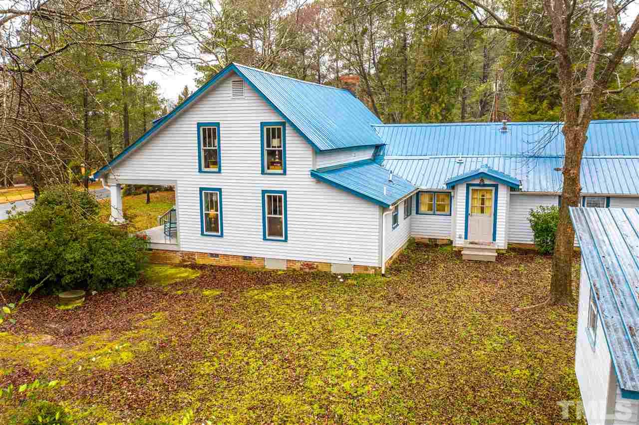 4007 Redwood Road Durham, NC 27704 - Photo 5 of 30 Right side of home. Mud room entrance, easy access to garden.