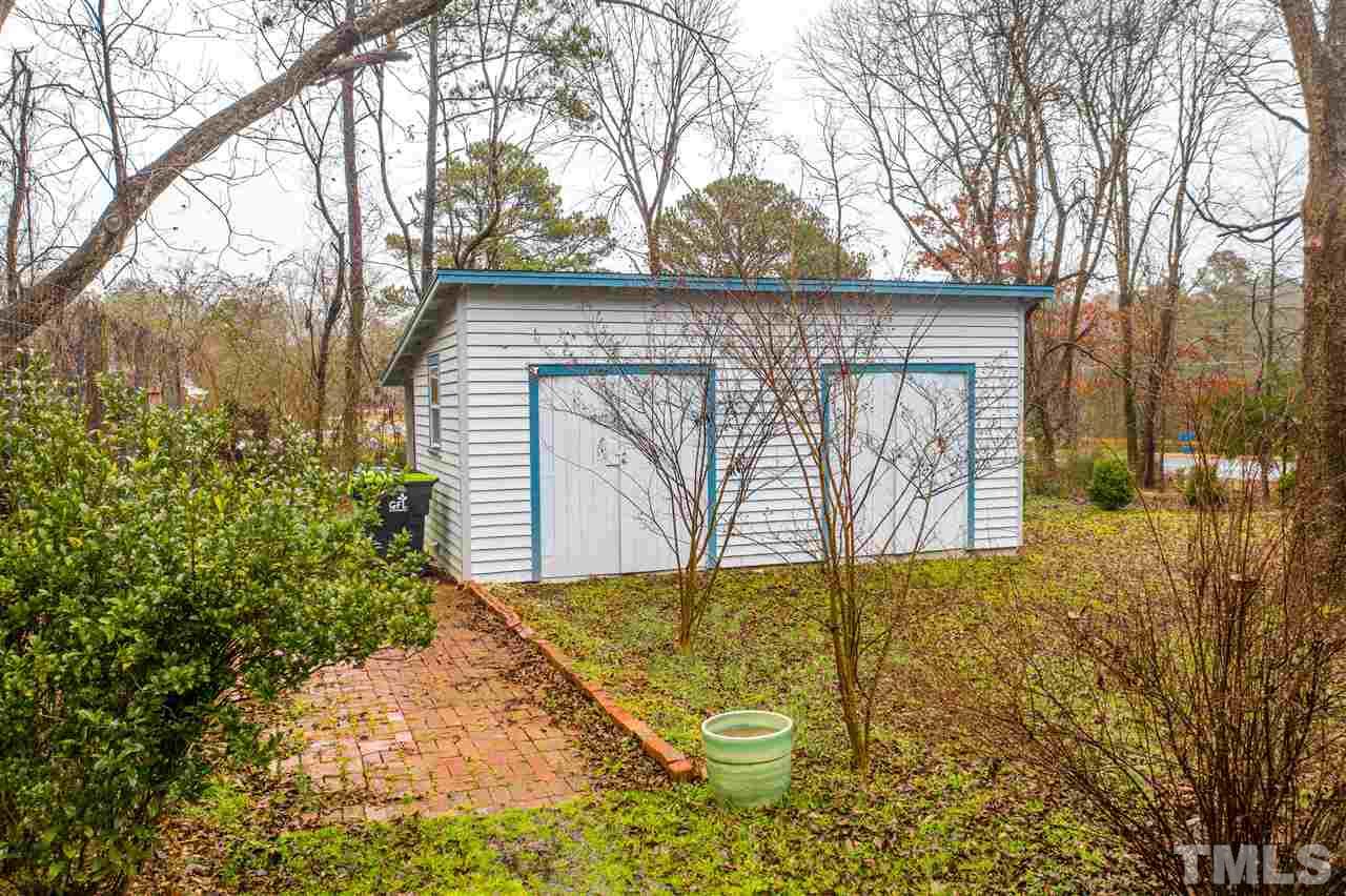 4007 Redwood Road Durham, NC 27704 - Photo 9 of 30 Double doors, concrete floor, covered rear porch and full electric. Enclosed garden area is adjacent.