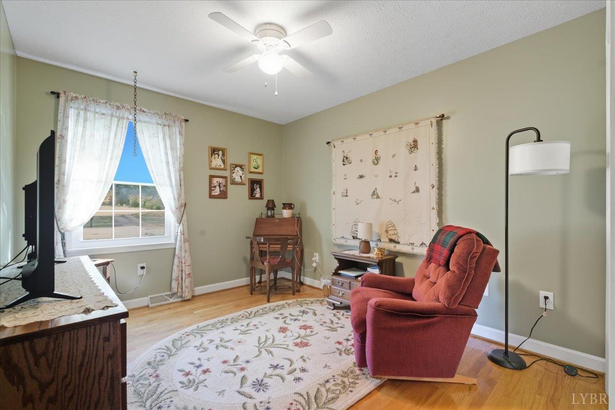 2121 Sunburst Road Evington, VA 24550 - Photo 18 of 41 a living room with furniture and a flat screen tv