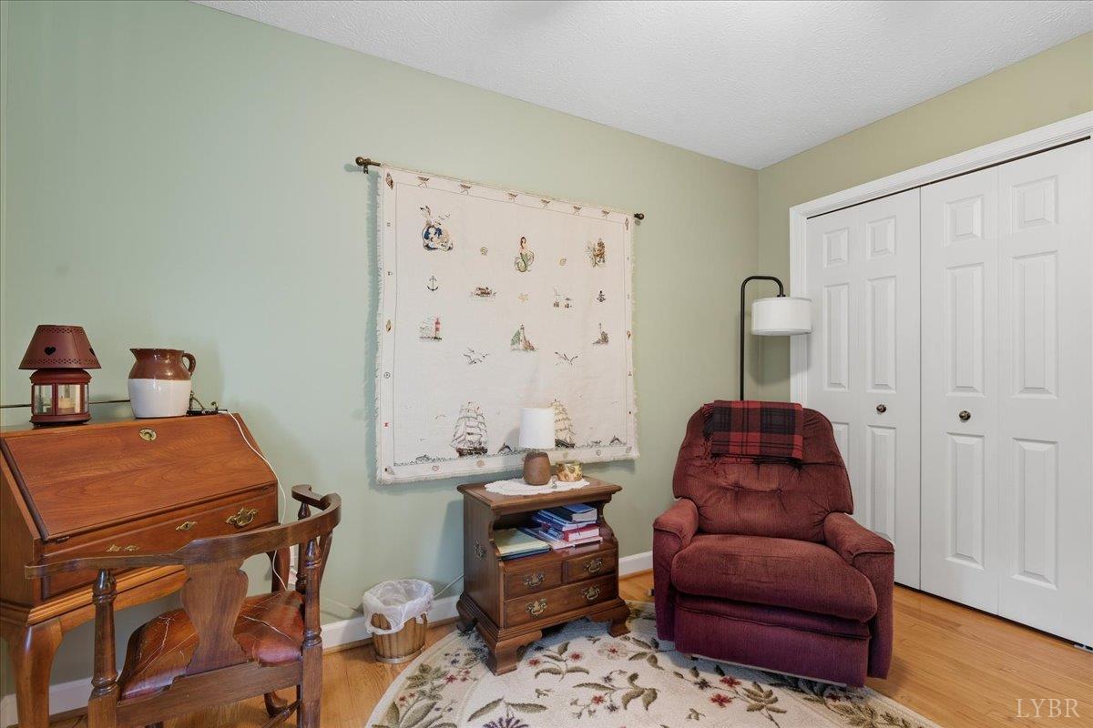 2121 Sunburst Road Evington, VA 24550 - Photo 19 of 41 a bedroom with furniture and a couch