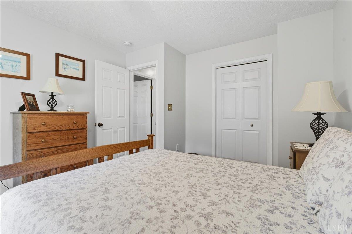 2121 Sunburst Road Evington, VA 24550 - Photo 21 of 41 a bedroom with a bed and cabinet