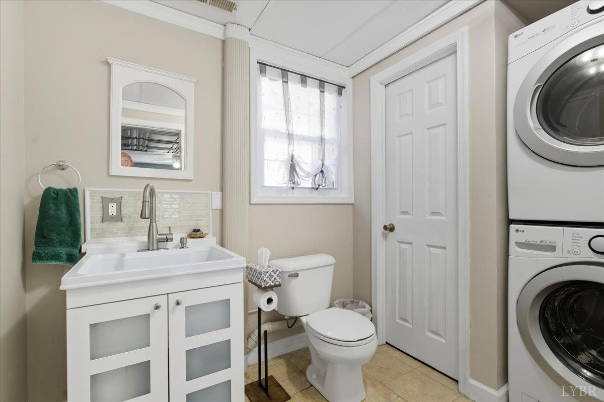 2121 Sunburst Road Evington, VA 24550 - Photo 22 of 41 a bathroom with a sink a toilet and a mirror