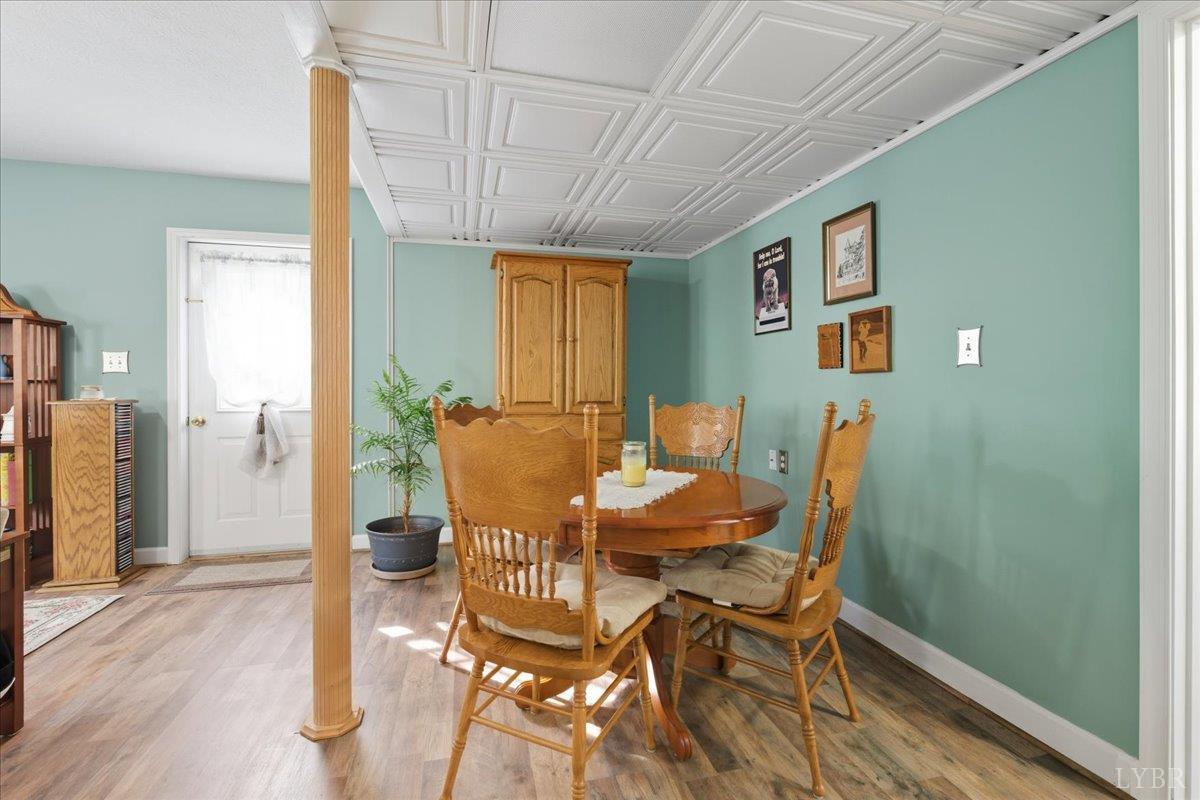 2121 Sunburst Road Evington, VA 24550 - Photo 25 of 41 a view of a dining room with furniture and a window
