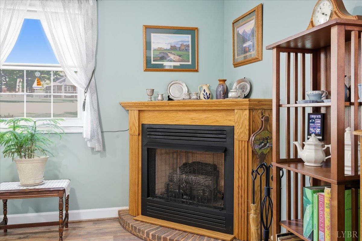 2121 Sunburst Road Evington, VA 24550 - Photo 27 of 41 a living room with furniture and a fireplace