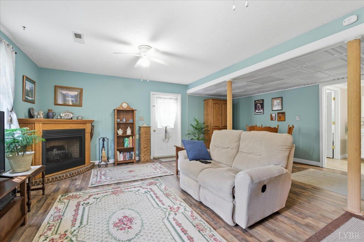 2121 Sunburst Road Evington, VA 24550 - Photo 28 of 41 a living room with furniture and a fireplace