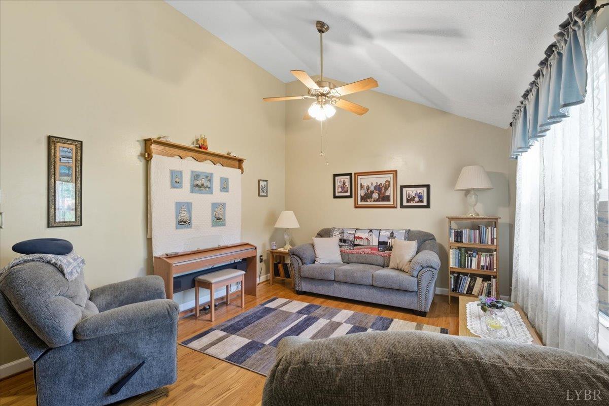 2121 Sunburst Road Evington, VA 24550 - Photo 6 of 41 a living room with furniture a rug and a window