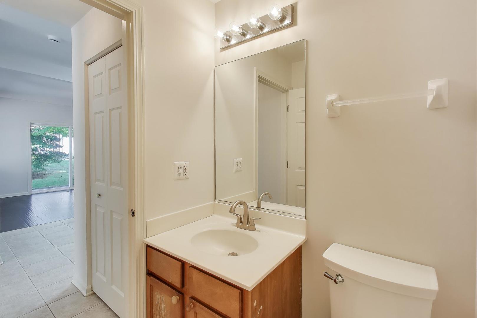 1677 South Candlestick Way Waukegan, IL 60048 - Photo 11 of 30 a bathroom with a sink a toilet and shower