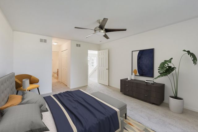 a bedroom with a bed and furniture