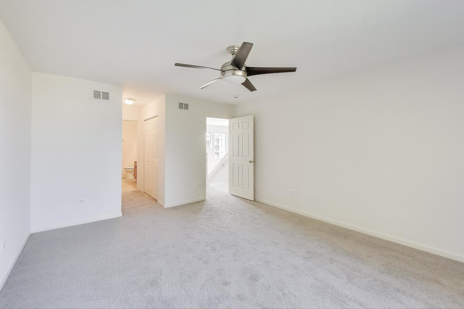 1677 South Candlestick Way Waukegan, IL 60048 - Photo 16 of 30 an empty room with a ceiling fan & a ceiling fan