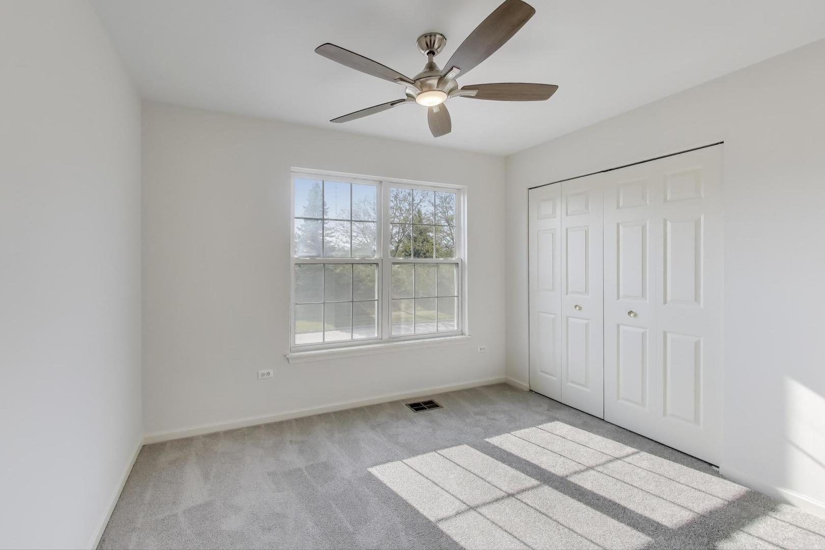 1677 South Candlestick Way Waukegan, IL 60048 - Photo 19 of 30 a view of an empty room with a window